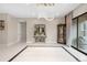 Spacious entrance featuring tiled floor and unique chandelier lighting fixture at 11193 Mission Walk St, Parker, CO 80134