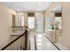 Bright foyer boasts modern tile flooring and stylish console table with floral decor at 11193 Mission Walk St, Parker, CO 80134