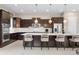 Beautiful kitchen featuring modern lighting, stainless steel appliances, and a large center island with seating at 11193 Mission Walk St, Parker, CO 80134