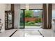 Modern living room with stone floors, stylish decor, and a view of the landscaped backyard at 11193 Mission Walk St, Parker, CO 80134
