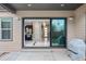 Outdoor patio showing the slider door that opens to a kitchen and dining area with stainless appliances at 11193 Mission Walk St, Parker, CO 80134