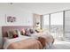 Bright bedroom featuring two twin beds, a workstation and a large window with beautiful views at 3100 E Cherry Creek South Dr # 1201, Denver, CO 80209
