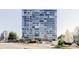 Modern high-rise building with expansive glass windows at 3100 E Cherry Creek South Dr # 1201, Denver, CO 80209