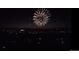 Night time aerial view of fireworks display over town at 749 Poppy Dr, Brighton, CO 80601