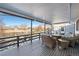 Relaxing deck with wicker furniture, offering a view of the backyard at 749 Poppy Dr, Brighton, CO 80601