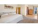 Main bedroom with large bed, dresser and access to balcony at 749 Poppy Dr, Brighton, CO 80601