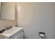 A bathroom with a toilet and a white sink at 3354 S Flower St # 14, Lakewood, CO 80227