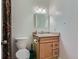 Bathroom featuring a toilet, a sink, and a shower curtain at 3354 S Flower St # 14, Lakewood, CO 80227