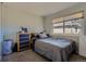 Bedroom featuring a neutral color scheme, a window with blinds, and comfortable carpet at 3354 S Flower St # 14, Lakewood, CO 80227