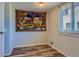 Bright bedroom features updated floors and a large window at 3354 S Flower St # 14, Lakewood, CO 80227