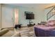 Cozy living room with wood floors, TV, and stairway at 3354 S Flower St # 14, Lakewood, CO 80227