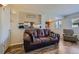 Relaxing living room featuring a comfortable sofa and a view into the kitchen at 3354 S Flower St # 14, Lakewood, CO 80227