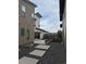 Modern backyard featuring a concrete patio, gravel, and wood fence at 9715 Taylor River Cir, Littleton, CO 80125