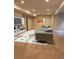 A spacious basement with a theater area, a large television, a gray couch and cozy carpet at 9715 Taylor River Cir, Littleton, CO 80125