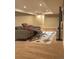 Finished basement area with theater seating, plush carpet, and a large entertainment center at 9715 Taylor River Cir, Littleton, CO 80125