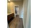 Bathroom featuring hardwood floors, granite countertops, undermount sinks, and a shower/tub combo at 9715 Taylor River Cir, Littleton, CO 80125