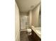 Modern bathroom featuring a glass-enclosed shower, toilet, and granite-topped vanity at 9715 Taylor River Cir, Littleton, CO 80125