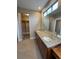 Large primary bathroom with a dual vanity, granite countertops, and plenty of natural light from clerestory windows at 9715 Taylor River Cir, Littleton, CO 80125