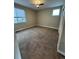Bedroom featuring a ceiling fan, neutral walls, carpeted floors, and windows letting in natural light at 9715 Taylor River Cir, Littleton, CO 80125