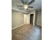 Comfortable bedroom with ceiling fan, neutral walls, and carpeted floors at 9715 Taylor River Cir, Littleton, CO 80125