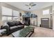 Comfortable bedroom featuring modern loft bed, dark furnishings, and a sleek ceiling fan at 9715 Taylor River Cir, Littleton, CO 80125