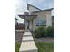 Modern two-story home with unique architecture, contemporary color palette and stylish front entry at 9715 Taylor River Cir, Littleton, CO 80125