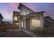 Modern two-story home with unique architecture, contemporary color palette and stylish front entry at 9715 Taylor River Cir, Littleton, CO 80125