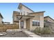 Stunning modern home featuring unique architectural details and a covered front porch with landscaped yard at 9715 Taylor River Cir, Littleton, CO 80125