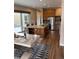 Spacious kitchen with a large island, stainless steel appliances, and rich wood cabinetry at 9715 Taylor River Cir, Littleton, CO 80125