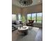 Inviting living room with large windows and a decorative ceiling fan at 9715 Taylor River Cir, Littleton, CO 80125