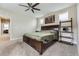 Spacious main bedroom with carpet, a ceiling fan, and natural light at 9715 Taylor River Cir, Littleton, CO 80125