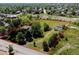 Large lot featuring lush landscape outlined in red showcasing a home and surrounding trees at 12196 W Belleview Dr, Littleton, CO 80127