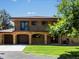 Beautiful two-story house with brick accents, a two-car garage, and a well-maintained yard at 12196 W Belleview Dr, Littleton, CO 80127