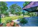 Exterior of home with covered patio and spacious backyard with shed at 7011 Poplar St, Commerce City, CO 80022