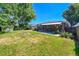 View of backyard showcasing the lawn and fence at 7011 Poplar St, Commerce City, CO 80022