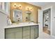 Beautiful bathroom with a double vanity, white countertop, sleek gold hardware, and honeycomb tile flooring at 7011 Poplar St, Commerce City, CO 80022