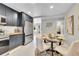 Updated kitchen featuring modern appliances, eat-in area, and ample storage at 7011 Poplar St, Commerce City, CO 80022