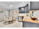 Bright eat-in kitchen features modern cabinets, stainless appliances, and stylish dining area at 7011 Poplar St, Commerce City, CO 80022