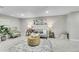 Cozy living room with carpet, couch, decor, and plenty of space for entertaining and relaxing at 7011 Poplar St, Commerce City, CO 80022