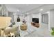 Well-lit living room showcasing a comfortable seating arrangement and stylish decor throughout at 7011 Poplar St, Commerce City, CO 80022