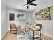 Contemporary office space with a desk, modern decor, ceiling fan, and hardwood floors at 7011 Poplar St, Commerce City, CO 80022