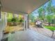 View of the expansive backyard, including a wooden deck, patio and outdoor cooking space at 2609 S Dahlia St, Denver, CO 80222