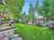 Manicured lawn and lush landscaping create an inviting backyard space at 2609 S Dahlia St, Denver, CO 80222