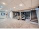 Spacious finished basement featuring carpet flooring, entertainment area, and space for fitness equipment at 2609 S Dahlia St, Denver, CO 80222