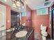 Bathroom features granite countertop, dual sinks, a tiled shower and private toilet at 2609 S Dahlia St, Denver, CO 80222