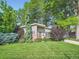 Charming single-story home featuring lush landscaping, a well-manicured lawn, and a welcoming facade at 2609 S Dahlia St, Denver, CO 80222