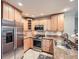 Well-equipped kitchen with stainless steel appliances, granite countertops, and ample cabinet space for storage at 2609 S Dahlia St, Denver, CO 80222