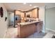 Cozy kitchen featuring granite countertops, stainless steel appliances, and natural wood cabinetry at 2609 S Dahlia St, Denver, CO 80222