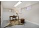 Basement office with neutral paint, desk, and ample natural light at 2318 S Lincoln St, Denver, CO 80210