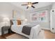 Cozy bedroom with a ceiling fan, natural light and hardwood floors at 2318 S Lincoln St, Denver, CO 80210